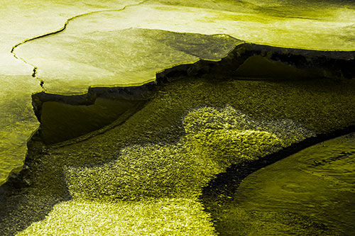 Cracked Ice Frozen Shoreline Melting (Yellow Tone Photo)