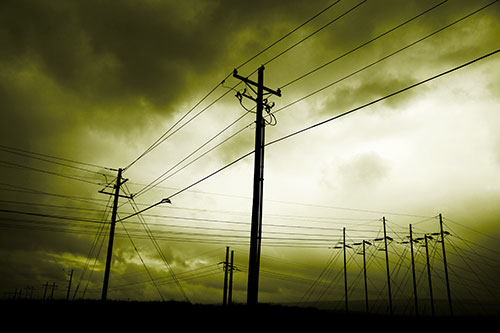 Crossing Powerlines Beneath Rainstorm (Yellow Tone Photo)