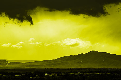 Dark Cloud Mass Above Mountain Range Horizon (Yellow Tone Photo)
