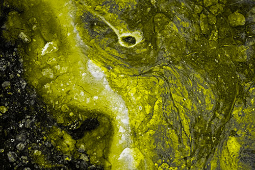 Distressed Oil Face Swirling Among Rocky Shore (Yellow Tone)