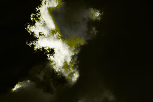 Evil Cloud Face Snarls Among Sky (Yellow Tone Photo)