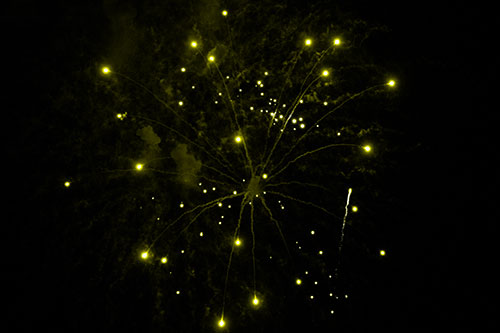 Firework Light Orbs Free Falling After Explosion (Yellow Tone Photo)