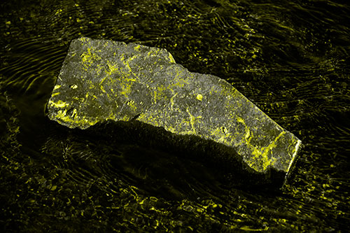 Massive Rock Atop Riverbed (Yellow Tone Photo)