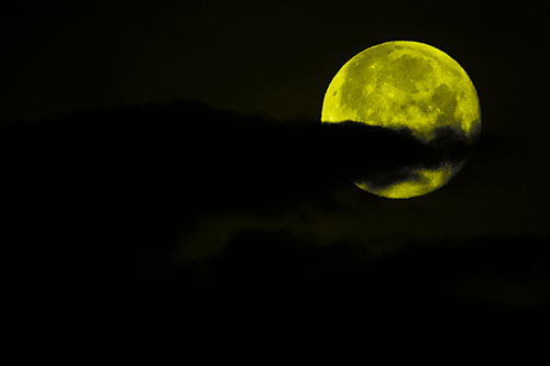 Pac Man Moon Swallows Clouds (Yellow Tone Photo)