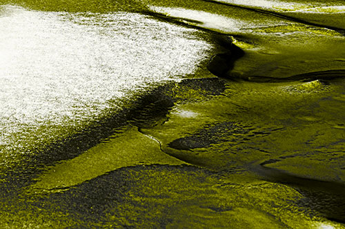 Sloping Ice Melting Atop River Water (Yellow Tone Photo)