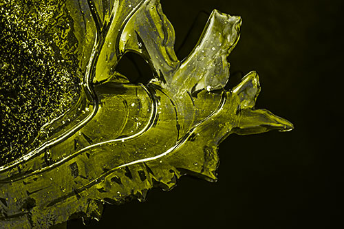 Smooth Ice Face Creature Hanging Above River Shoreline (Yellow Tone)