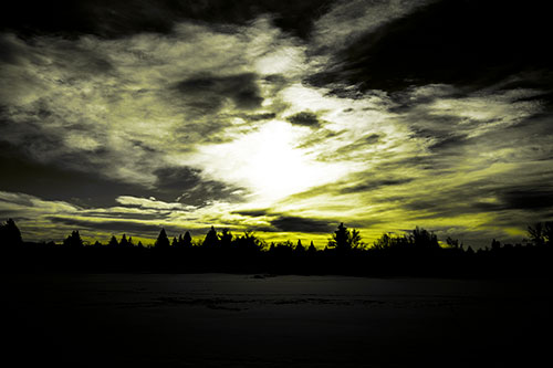 Sun Vortex Illuminates Clouds Above Dark Lit Lake (Yellow Tone Photo)