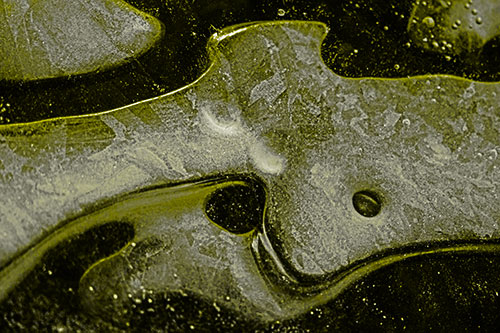 Swirling Frozen Smiling Bubble Eyed River Ice Face (Yellow Tone)